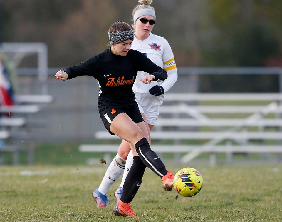 Ashland High School's Aubrey Hubler (7) takes a shot as Springfield High School's Elise Dodson (5) is late to defend scoring a goal in the first half during high school girls soccer action at Ashland Community Soccer Stadium Wednesday, Oct. 19, 2022. TOM E. PUSKAR/ASHLAND TIMES-GAZETTE