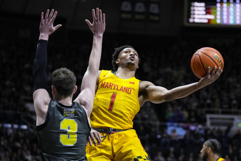 Maryland guard Jahmir Young (1) shoots around Purdue guard Braden Smith (3) during the first half of an NCAA college basketball game in West Lafayette, Ind., Sunday, Jan. 22, 2023. (AP Photo/Michael Conroy)