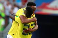 <p>Davinson Sanchez and Yerry Mina celebrate after Mina put Colombia into the lead </p>