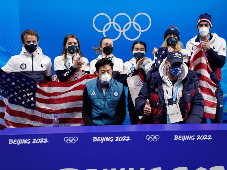 Nathan Chen (center) and his US Figure Skating teammates await results at the 2022 Beijing Olympics.