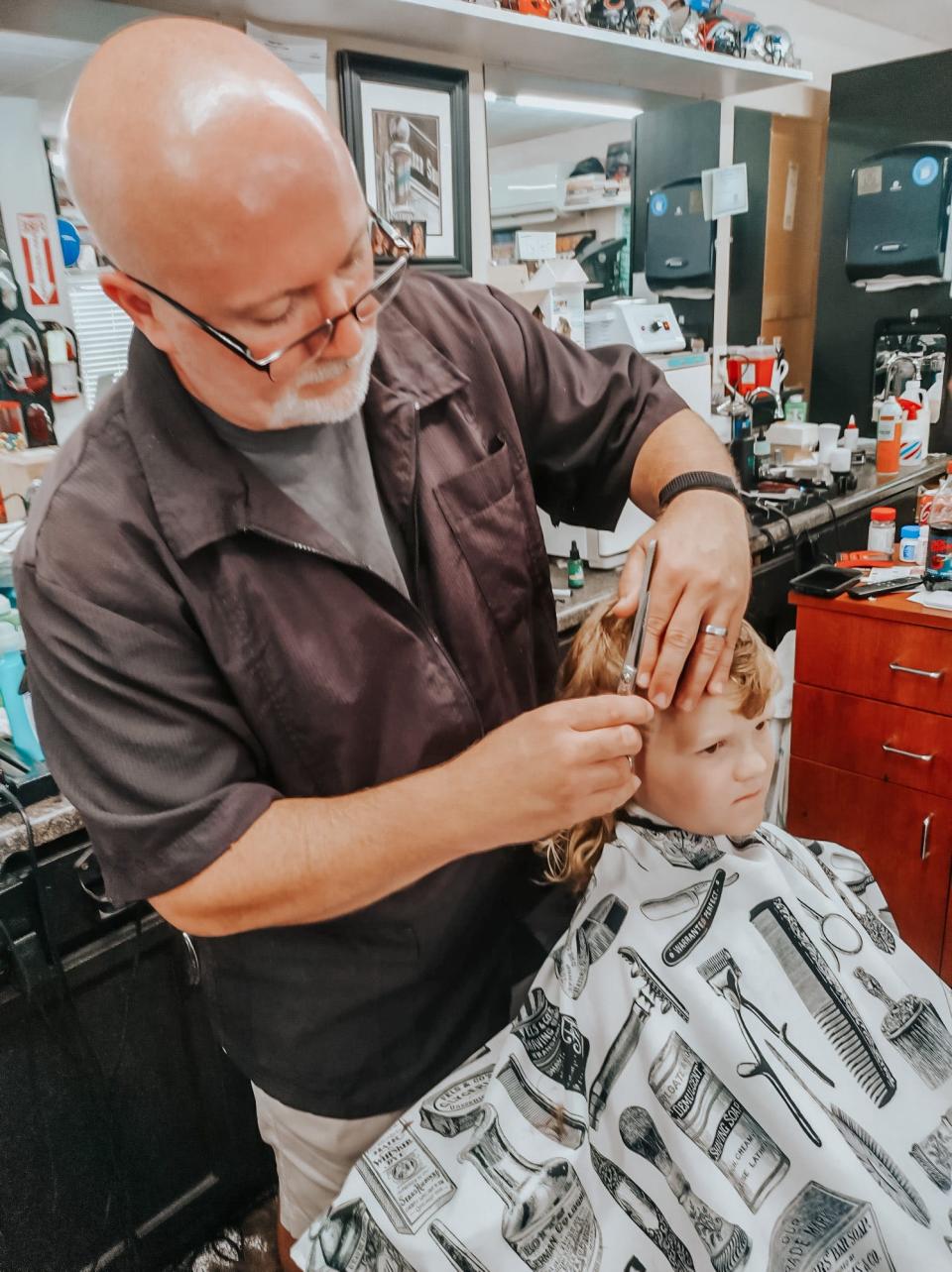 Jace Harness gets a touch-up on his "competitive" mullet at Mac's Barber Shop.