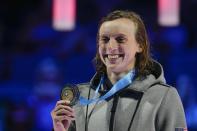 Katie Ledecky reacts at the medal ceremony after winning the Women's 400 Freestyle during wave 2 of the U.S. Olympic Swim Trials on Monday, June 14, 2021, in Omaha, Neb. (AP Photo/Charlie Neibergall)