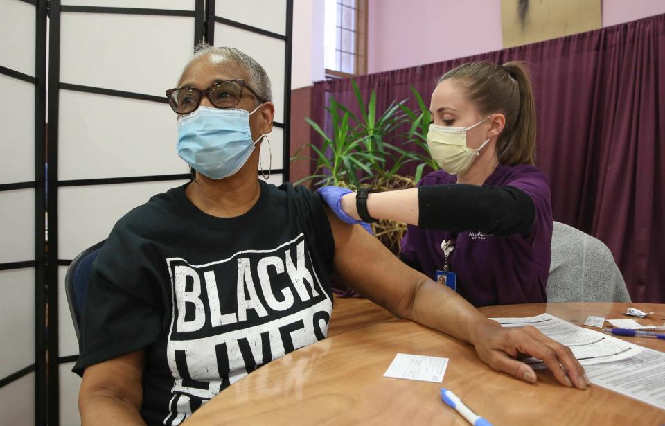 Mercy College nursing student Emily Hixson administers a shot to Kimberly Middlebrooks of Des Moines during a vaccination clinic on Saturday, March 27, 2021, at Corinthian Baptist Church in Des Moines. The clinic, organized by Broadlawns Medical Center and United Way, provided more than 1,100 shots to Des Moines area residents.