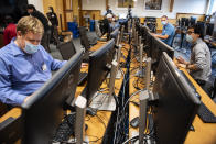 In this photo provided by the University of Vermont Health Network, IT staff at the University of Vermont Medical Center in Burlington, Vt., continue work to scan thousands of the hospital's computer systems for malware on Friday, Nov. 20, 2020, after the Oct. 28 cyberattack forced a shut down of the hospital's electronic medical records system and other key systems. (Ryan Mercer/University of Vermont Health Network via AP)