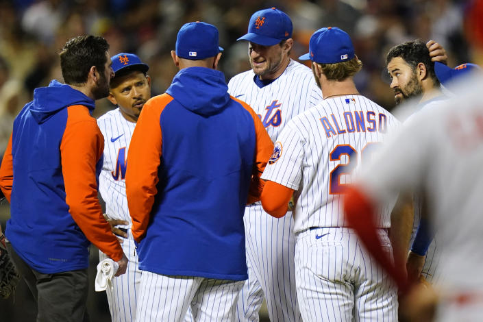 New York Mets starting pitcher Max Scherzer talks to teammates during the sixth inning of a baseball game against the St. Louis Cardinals on Wednesday, May 18, 2022, in New York. (AP Photo/Frank Franklin II)