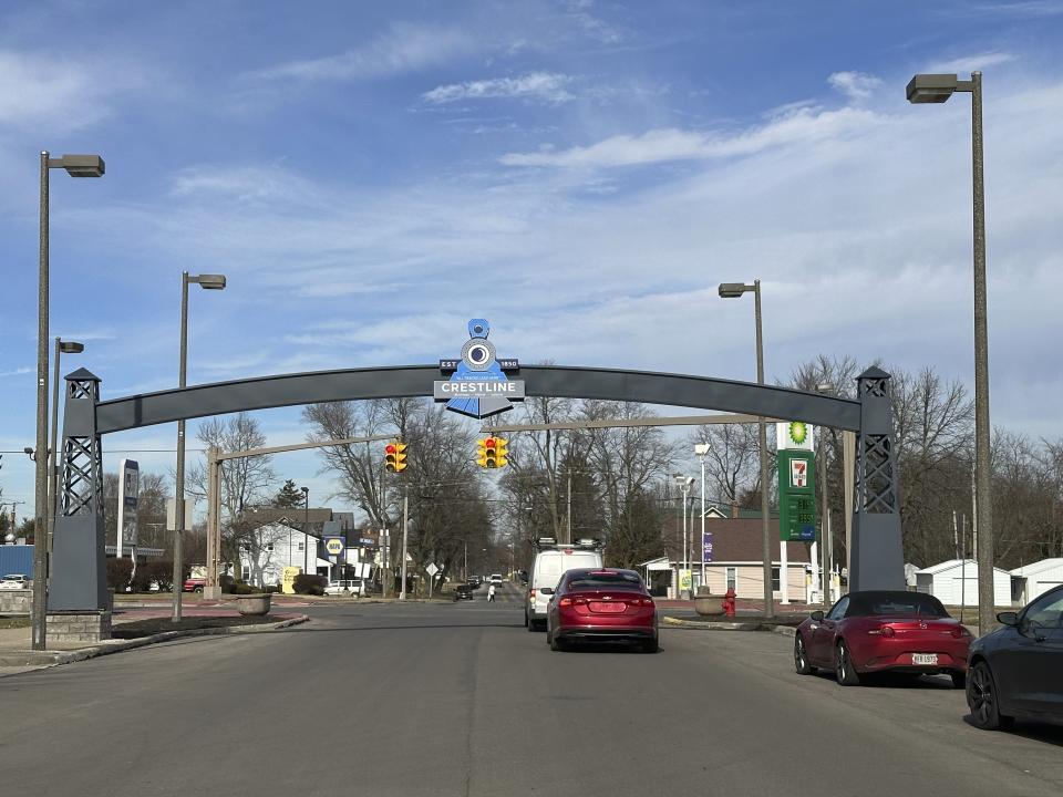 An arch bearing a train-themed logo spans a street in Crestline, Ohio, on Thursday, Feb. 8, 2024. Crestline is considered the birthplace of the political "whistle-stop." (AP Photo/Julie Carr Smyth)