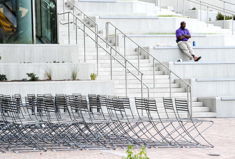 Custodian Gary Whitner takes a break from cleaning inside the new College of Business during the first day of fall classes at Clemson University on Aug. 19 in Clemson, S.C.