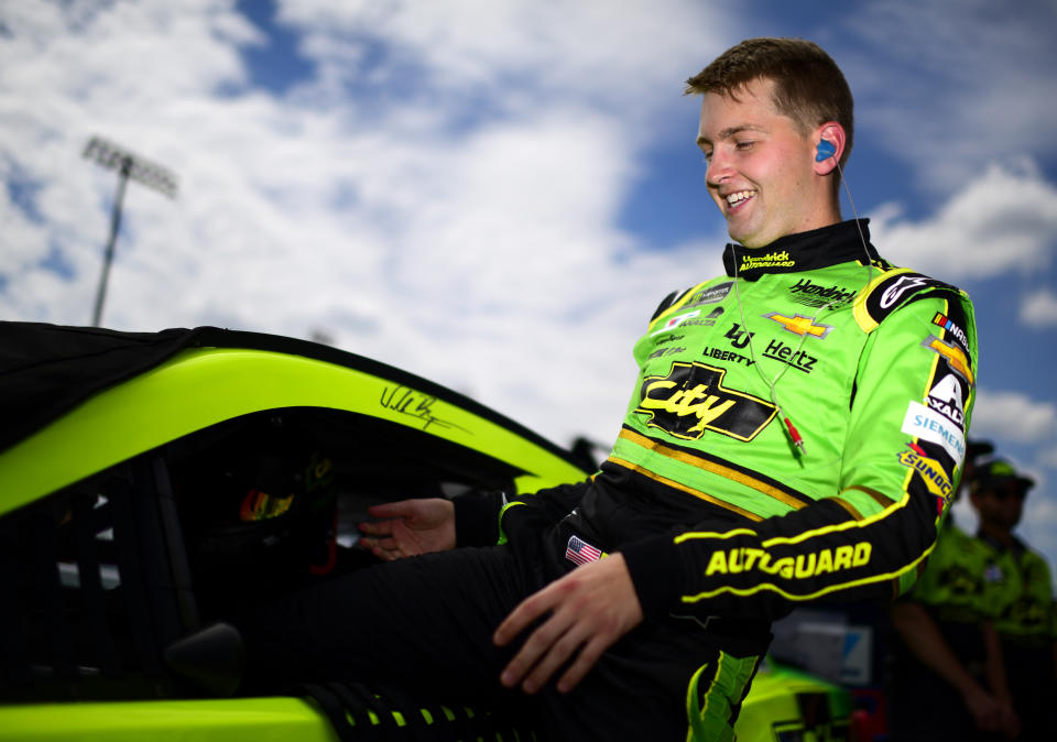 DARLINGTON, SOUTH CAROLINA - AUGUST 31: William Byron, driver of the #24 HendrickAutoguard/CityChvrltThrwbck Chev, climbs into his car prior to qualifying for the Monster Energy NASCAR Cup Series Bojangles' Southern 500 at Darlington Raceway on August 31, 2019 in Darlington, South Carolina. (Photo by Jared C. Tilton/Getty Images)