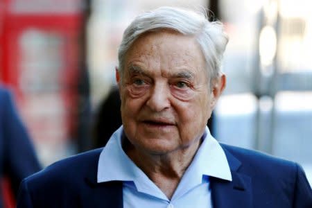 FILE PHOTO - Business magnate George Soros arrives to speak at the Open Russia Club in London, Britain June 20, 2016. REUTERS/Luke MacGregor/File Photo