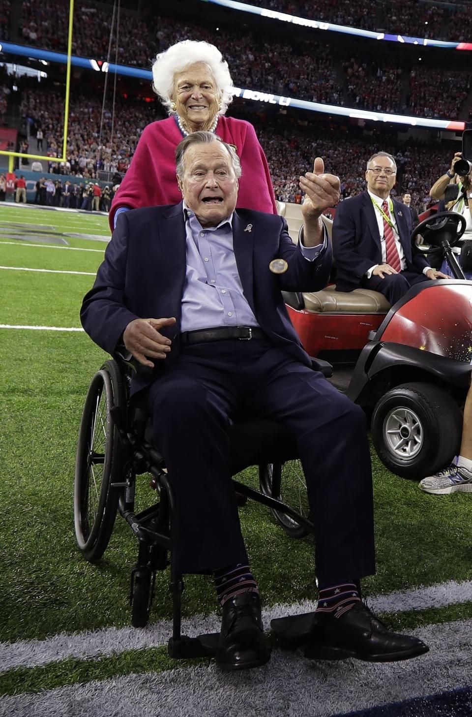 Former President George H.W. Bush and wife, Barbara, walk off the field before the NFL Super Bowl 51 football game between the Atlanta Falcons and the New England Patriots Sunday, Feb. 5, 2017, in Houston. (AP Photo/David J. Phillip)&nbsp; (Photo: ASSOCIATED PRESS)