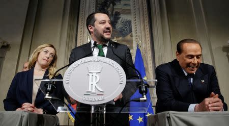 FILE PHOTO: League party leader Matteo Salvini (C) speaks next President of Fratelli d'Italia party (Brothers of Italy) Giorgia Meloni (L) and Forza Italia leader Silvio Berlusconi following a talk with Italian President Sergio Mattarella at the Quirinale palace in Rome, Italy, April 12, 2018. REUTERS/Max Rossi/File Photo