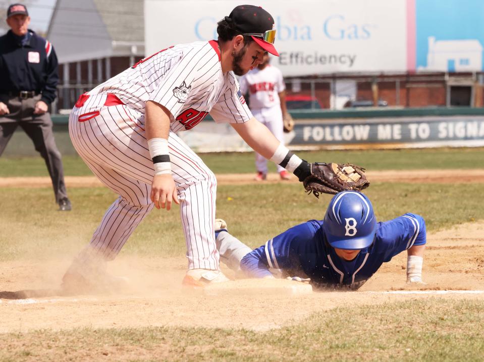 Braintree's Sean O'Rourke gets back safely to first base as Brockton's Zeke Inchaustegui makes the tag during a game on Friday, April 21, 2023. 