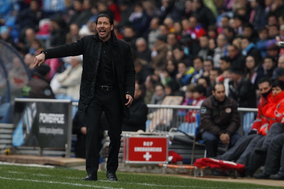 Atletico's coach Diego Simeone shouts during a Spanish La Liga soccer match between Atletico Madrid and Valladolid at the Vicente Calderon stadium in Madrid, Spain, Saturday, Feb. 15, 2014. (AP Photo/Gabriel Pecot)