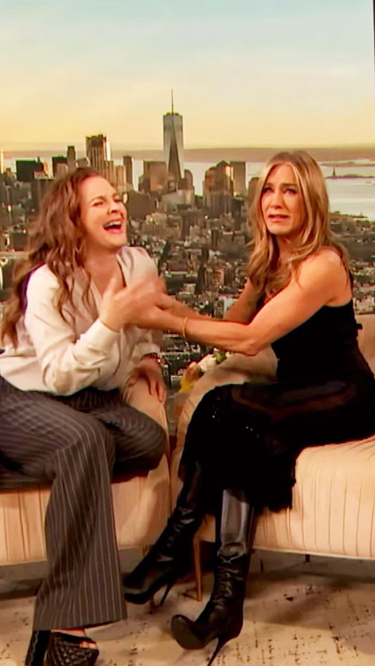 Jennifer Aniston, right, helped Drew Barrymore experience her first hot flash during an episode of 