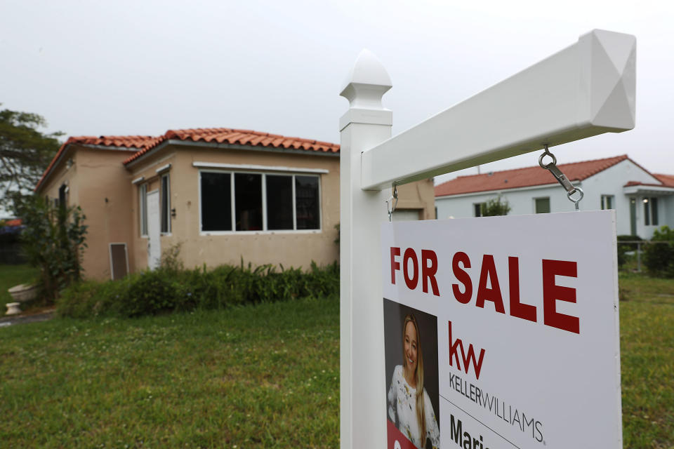 MIAMI, FLORIDA - JANUARY 30: A For Sale sign is seen outside of a home on January 30, 2019 in Miami, Florida. The pending home sales index dropped 2.2 percent to 99.0, down from 101.2 in November, the weakest reading since April 2014 according to the National Association of Realtors. (Photo by Joe Raedle/Getty Images)