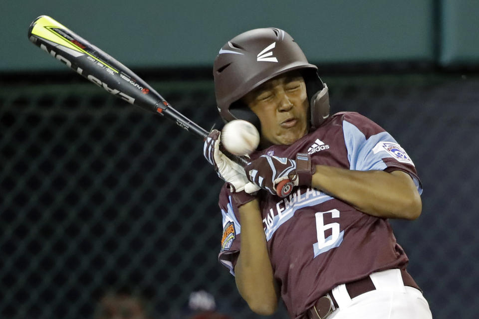 FILE - Barrington, R.I.'s Miles Fontaine is hit by a pitch from Elizabeth, N.J.'s Derek Escobar during the fourth inning of a baseball game at the Little League World Series in South Williamsport, Pa., in this Tuesday, Aug. 20, 2019, file photo. New Jersey won 2-0. The Little League World Series is planning to return in 2021 after last year's edition was canceled due to the COVID-19. (AP Photo/Tom E. Puskar, File)