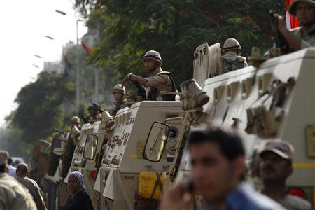 Soldiers secure a road during the presidential elections in Cairo May 26, 2014. REUTERS/Mohamed Abd El Ghany