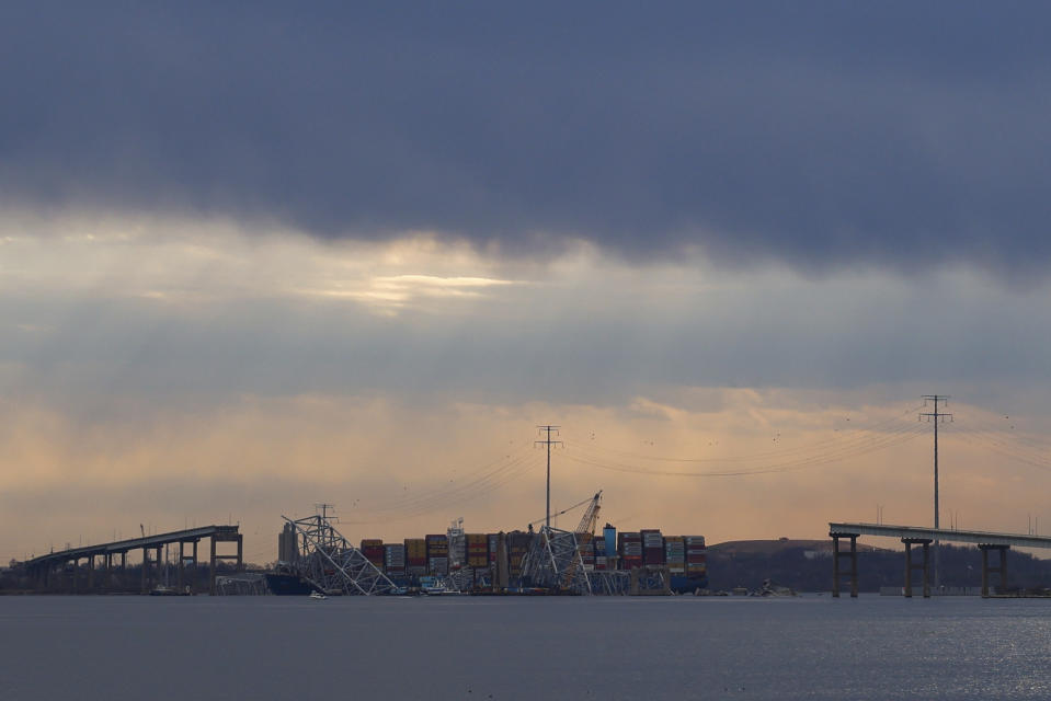 Wreckage of the Francis Scott Key Bridge rests on the container ship Dali, Saturday, March 30, 2024, in Baltimore. (AP Photo/Julia Nikhinson)