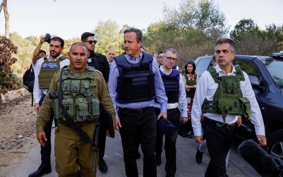 British Foreign Secretary David Cameron and Israeli Foreign Minister Eli Cohen visit Kibbutz Beeri
