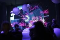 Visitor to the CERN watch a projection at 'Universe of Particles' exhibition in Geneva. Physicists said on Tuesday that they had narrowed the search for the elusive sub-atomic Higgs boson particle that would confirm the way science describes the Universe