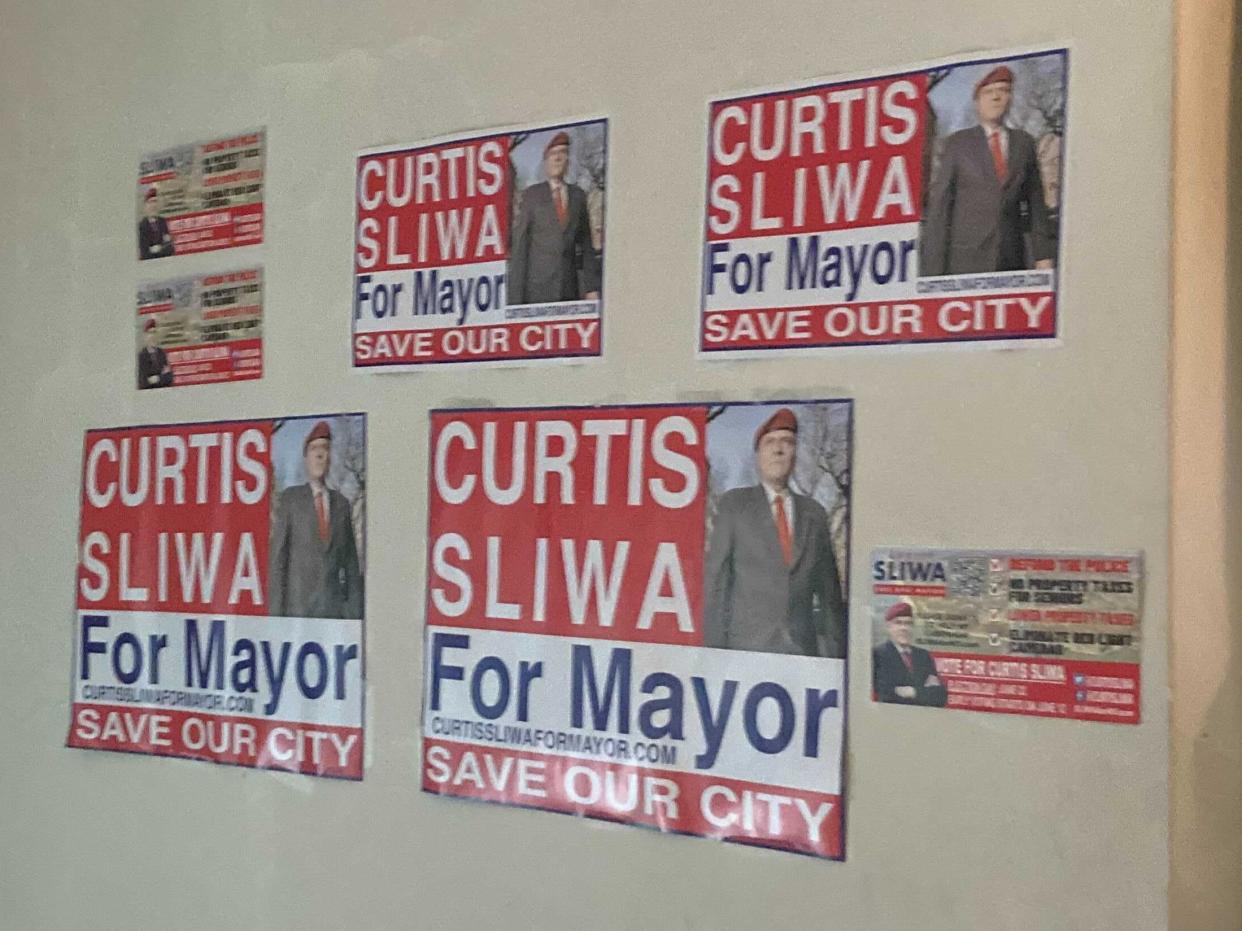 Curtis Sliwa campaign posters.