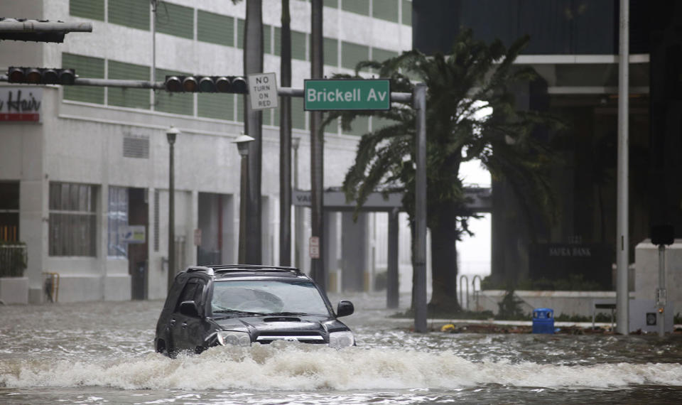 <p><strong>Miami</strong><br> A vehicle drives on flooded Brickell Avenue in Miami on Sept. 10, 2017, as Hurricane Irma passes. (Photo: Mike Stocker/South Florida Sun-Sentinel via AP) </p>