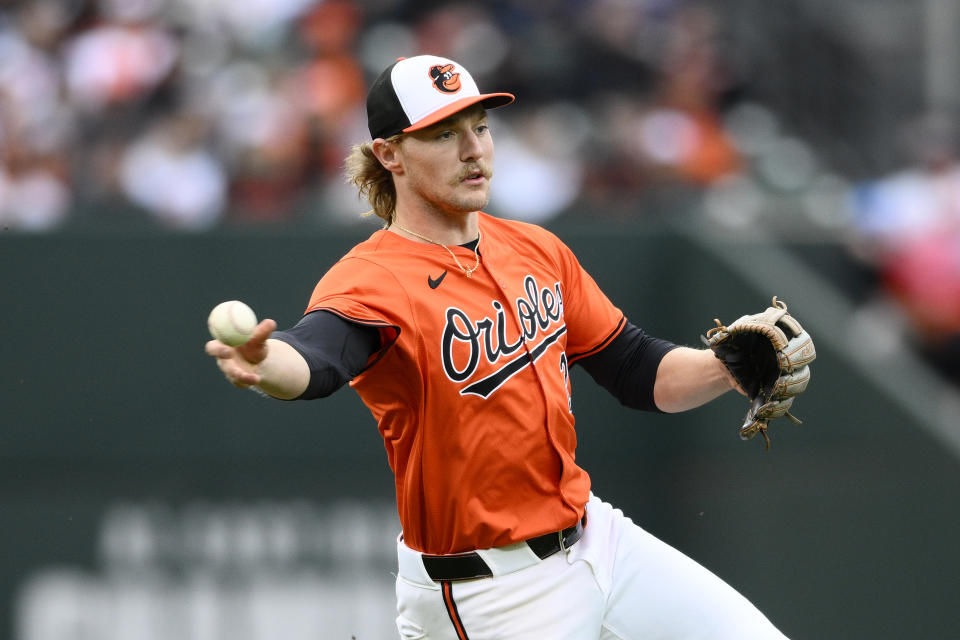 Baltimore Orioles shortstop Gunnar Henderson throws to first base to put out Oakland Athletics' Esteury Ruiz during the first inning of a baseball game, Saturday, April 27, 2024, in Baltimore. (AP Photo/Nick Wass)