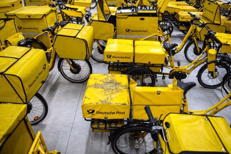 Deutsche Post bicycles are available at the Magdeburg-Buckau delivery location. The German postal service has been given permission to increase postage for postcards and letters by around 10.5 percent from the beginning of next year, the German postal network agency regulator said on Wednesday. Klaus-Dietmar Gabbert/dpa