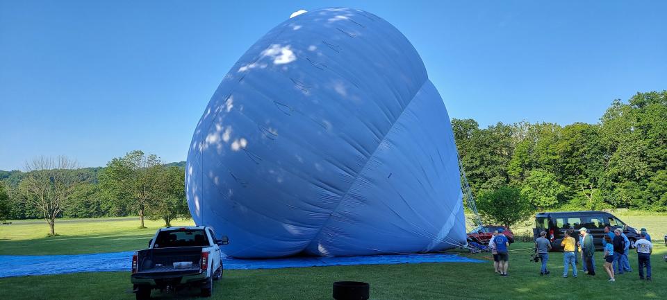 The hot air balloon being used for a cross-Atlantic flight is inflated ahead of the expected September launch from Presque Isle, Maine.