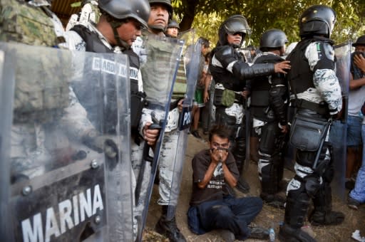 Central American migrants are blocked by members of the Mexican National Guard in Chiapas State on January 23