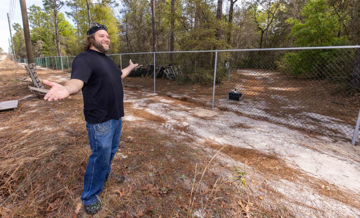 Robbie Delli-Veneri stands on what he believes to be an easement road near his property on March 11. He claims he has been land locked due to a chain-link fence put up by developer On Top of the World. “I’ve just been thrown into a 10-acre prison cell,” Delli-Veneri said. His property is located at 10495 SW 105th St in Ocala. On Top of the World installed the fence on its property, closing off access to his driveway. According to the Marion County Property Appraiser's Office, OTOW did nothing wrong and the driveway that he’s been using since 2018, when he bought the property, was a dirt road created by other people and was located on OTOW property. Delli-Veneri does have access to his property from SW 105th Avenue and SW 100th Street, but those passages are heavily wooded and will cost him thousands of dollars to clear, according to Delli-Veneri.