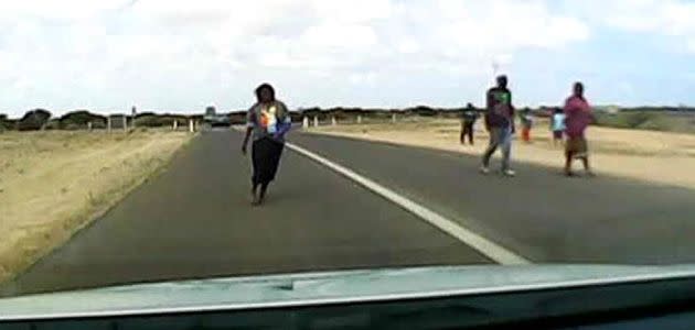 A still of video footage taken from the front of a police car on the Eyre Highway.