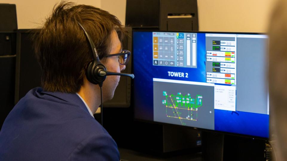 A student plays the role of pilots landing and taking off during air traffic control training at Embry-Riddle Aeronautical University in May, 2024.