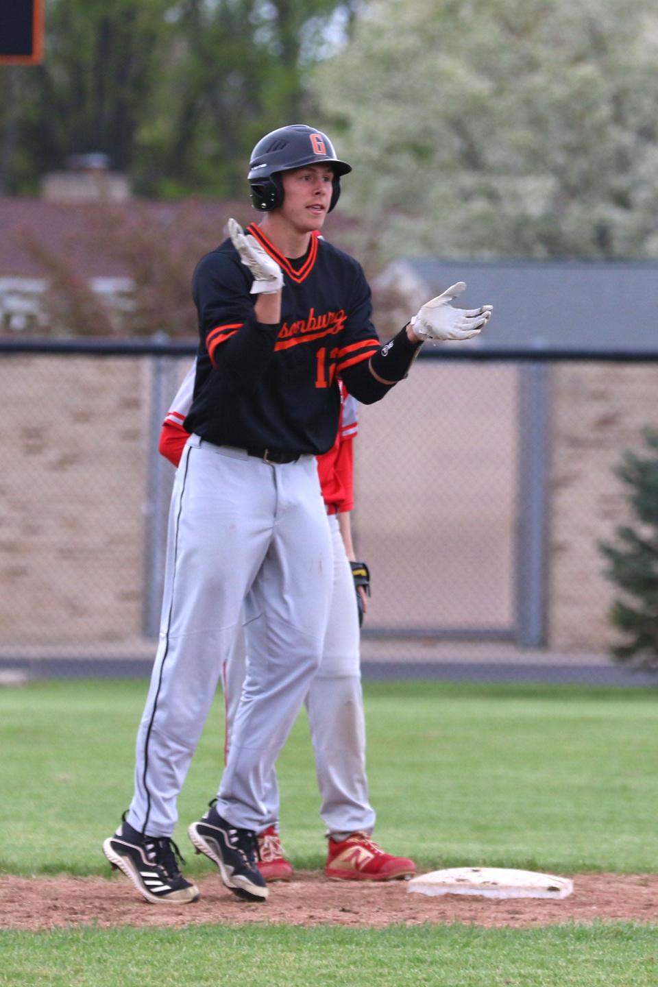 Gibsonburg&#39;s Khartir Miller celebrates his sixth inning RBI single.