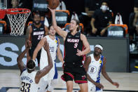 Miami Heat forward Kelly Olynyk (9) shoots over Indiana Pacers center Myles Turner (33) during the second half of an NBA basketball first round playoff game, Saturday, Aug. 22, 2020, in Lake Buena Vista, Fla. (AP Photo/Ashley Landis, Pool)