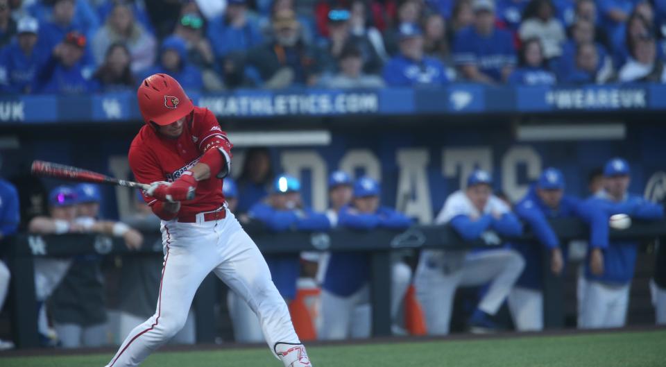 Louisville’s JT Benson hits a double against Kentucky.April 25, 2023