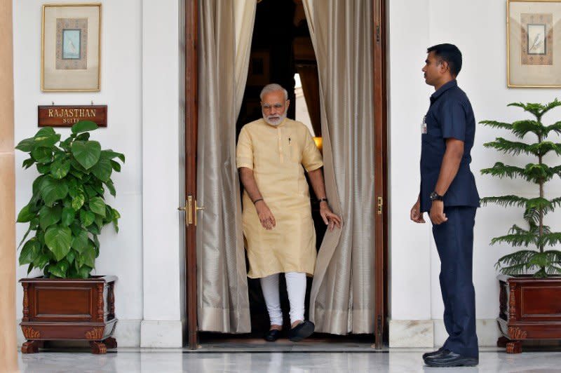 India's Prime Minister Narendra Modi makes his way to greet Afghan President Ashraf Ghani (not pictured) inside Hyderabad House in Delhi, India September 14, 2016. REUTERS/Cathal McNaughton