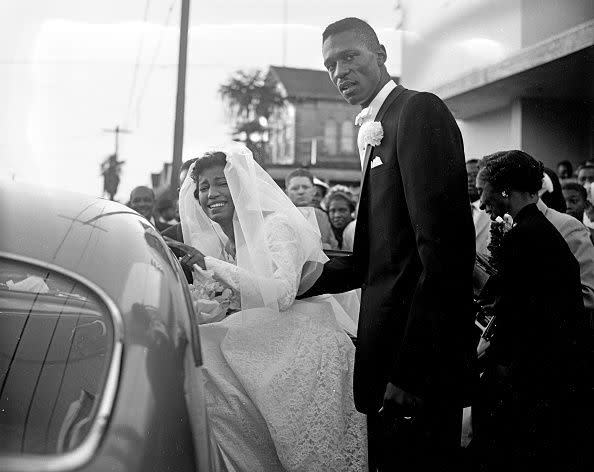 OAKLAND, CA - DECEMBER 09: Rose Swisher and her husband Bill Russell following their wedding in Oakland, CA., on December 9, 1956. (Bill Young/San Francisco Chronicle via Getty Images)