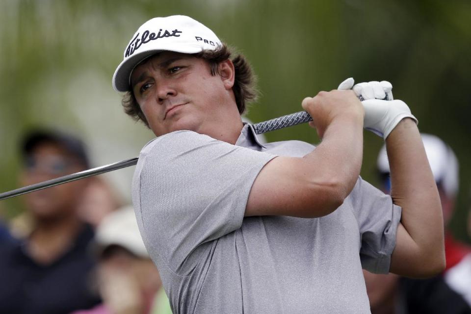 Jason Dufner hits from the 18th hole during the first round of the Cadillac Championship golf tournament Thursday, March 6, 2014, in Doral, Fla. (AP Photo/Wilfredo Lee)