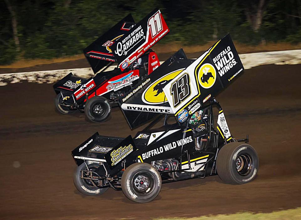 Mark Dobmeier of  Grand Forks , N.D. (13), shown battling fellow Grand Forks driver Brendan Mullen, won the NOSA Sprints feature during the weekly racing program at Casino Speedway on Sunday, July 23, 2023.