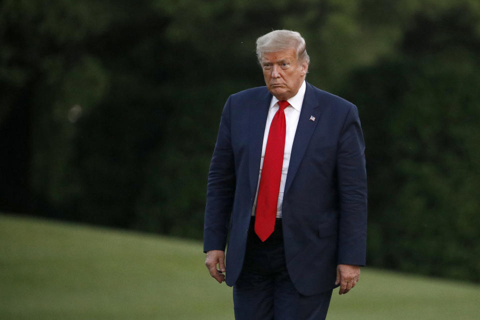 President Donald Trump walks on the South Lawn of the White House in Washington, Saturday, May 30, 2020, after stepping off Marine One as he returns from Kennedy Space Center for the SpaceX Falcon 9 launch. (AP Photo/Patrick Semansky)