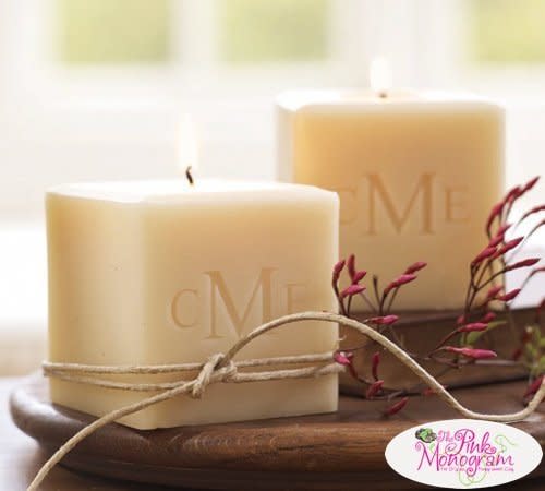 <a href="http://www.thepinkmonogram.com/62682/monogrammed/carved-solutions-monogrammed-soy-pillar-candles/?gclid=CIW868KxisYCFUyPHwodb78A7Q" target="_blank"> Carved Solutions Monogrammed Soy Pillar Candles, $28</a>