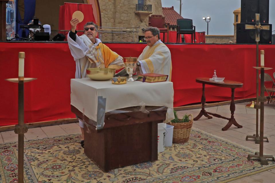 Father Phil Egitto of Our Lady of Lourdes Catholic Church in Daytona Beach, conducts the Easter Sunrise Service in 2023. Before this year's service, Father Egitto said “Easter calls us to boldly live our faith with action.”