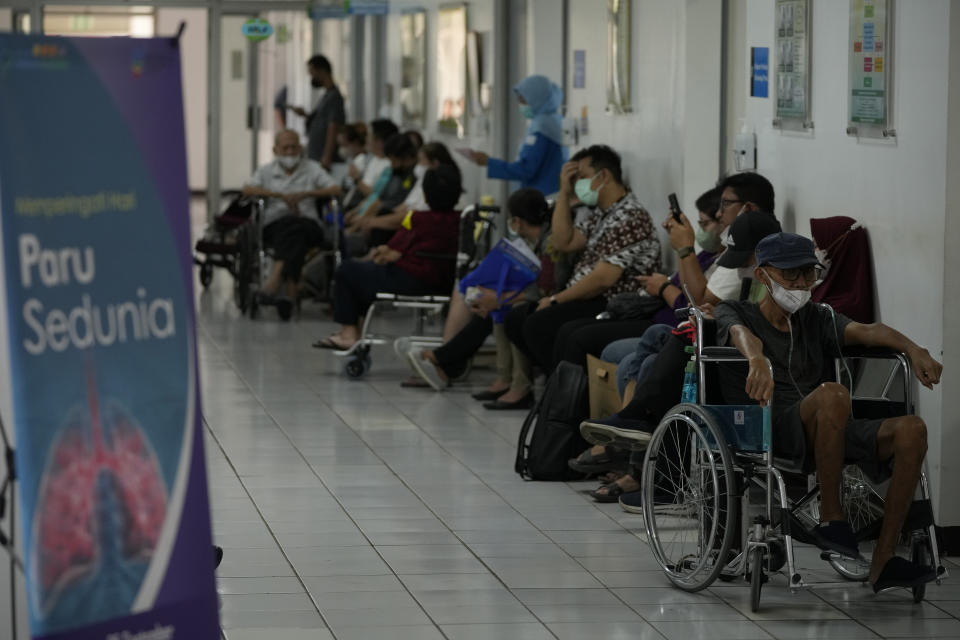 Patients wait in a hallway at Persahabatan Hospital, a national respiratory referral hospital, in Jakarta, Indonesia, on Sept. 22, 2023. Pollution is causing respiratory illnesses and deaths to rise in Indonesia's island of Java, including the capital, Jakarta. Data gathered by IQAir, a Swiss air technology company, regularly ranks Jakarta as one of the most polluted cities in the world. Blue skies are a rare sight and the air often smells like fuel or heavy smoke.(AP Photo/Achmad Ibrahim)