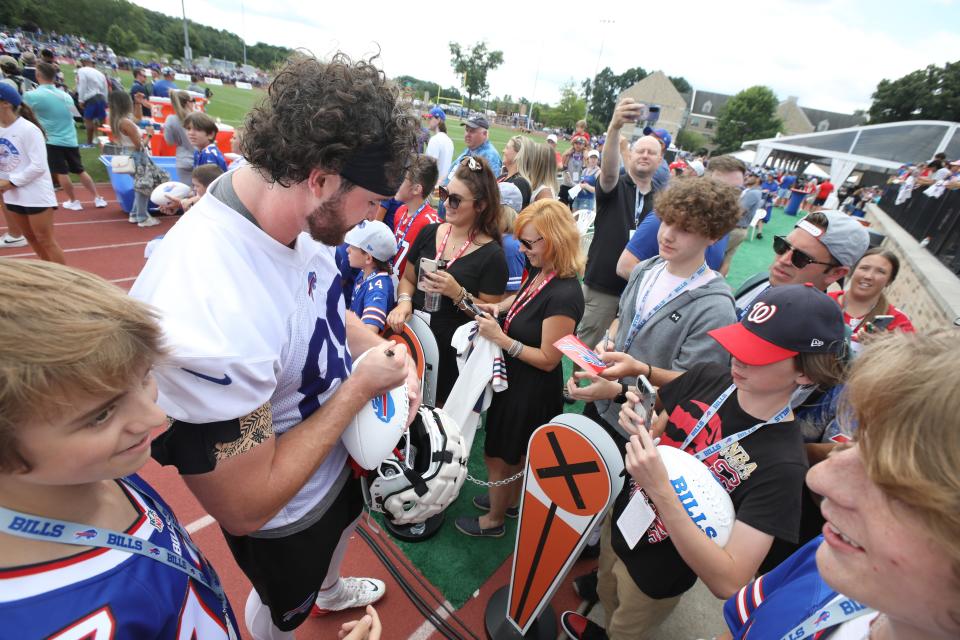 Bills tight end Dawson Knox signs autographs for fans on the second day of the Buffalo Bills training camp at St. John Fisher University in Rochester Monday, July 25, 2022. 