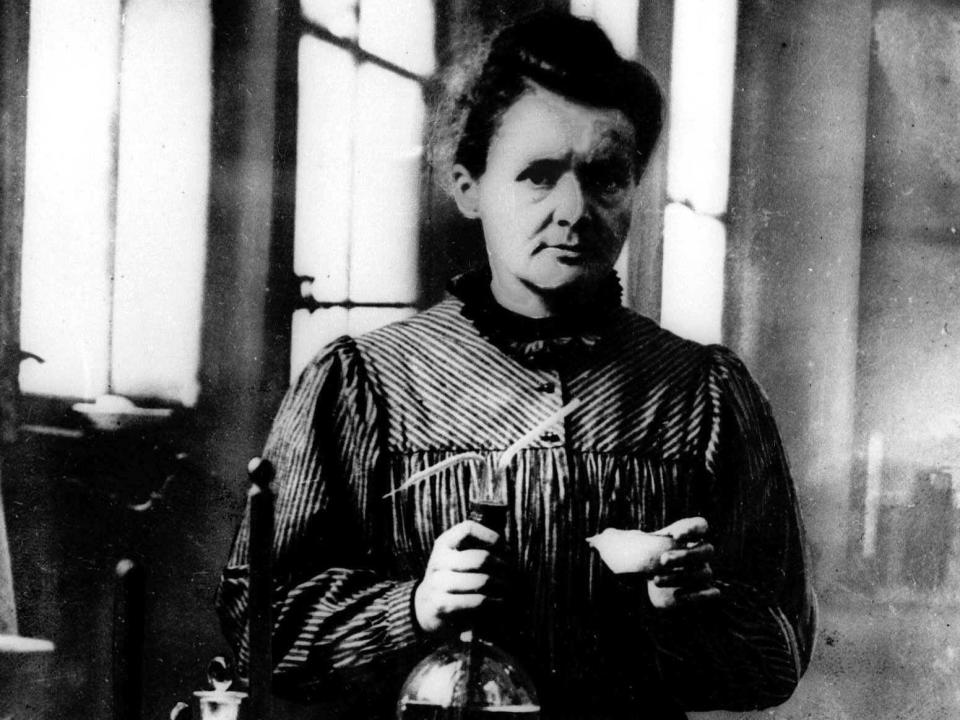 Scientist Marie Curie works in a laboratory.