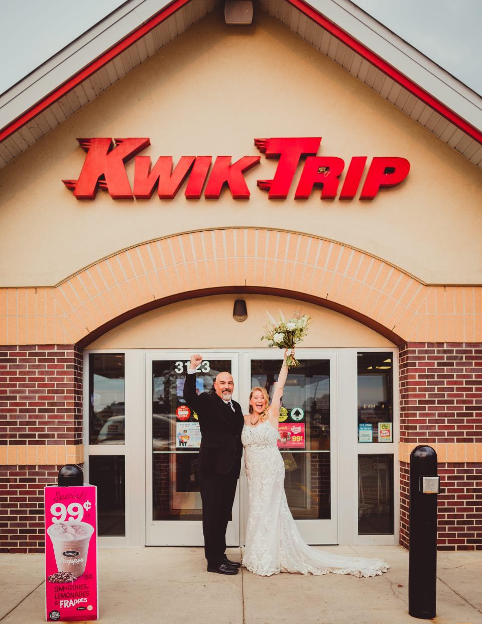 Ashley Ormes and Mark Steinke at Kwik Trip in wedding attire.