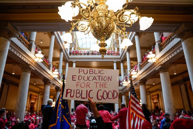 Educators and their supporters gather in the Capitol Building as teachers hold a one day walkout at the statehouse in Indianapolis