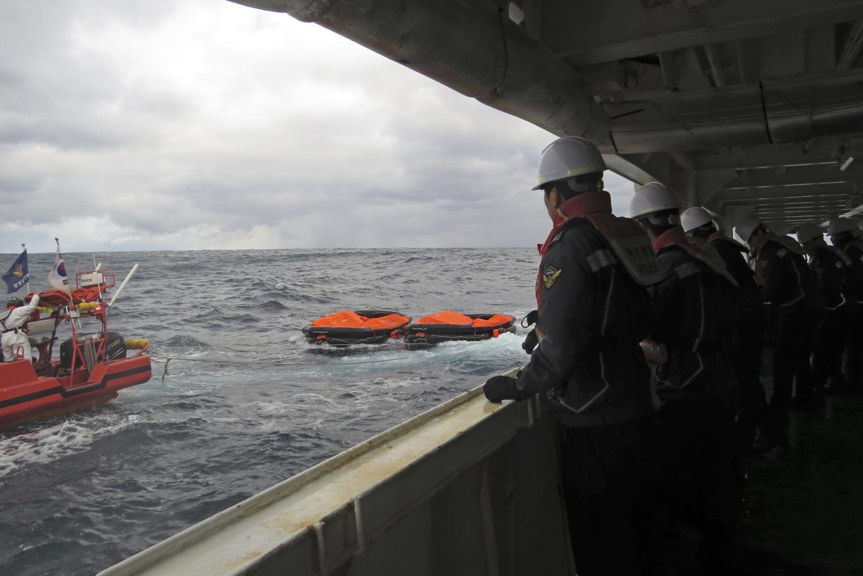 In this photo provided by the Korea Coast Guard, members of South Korea coast guard conduct a search operation in waters between South Korea and Japan, . South Korean and Japanese coast guards were searching for crew members of a cargo ship that sank early Wednesday in waters between South Korea and Japan, South Korean officials said Wednesday South Korea Japan Ship Sinking, At Sea - 24 Jan 2023