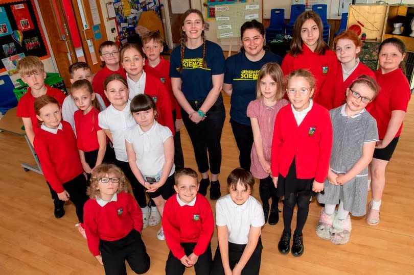 Charlotte Cranston and Sasha Wood with pupils of New Abbey Primary